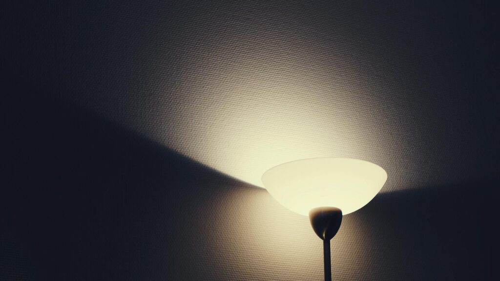 Warm glowing lamp casting soft light — creating a calming therapy environment at MindWell Psychology